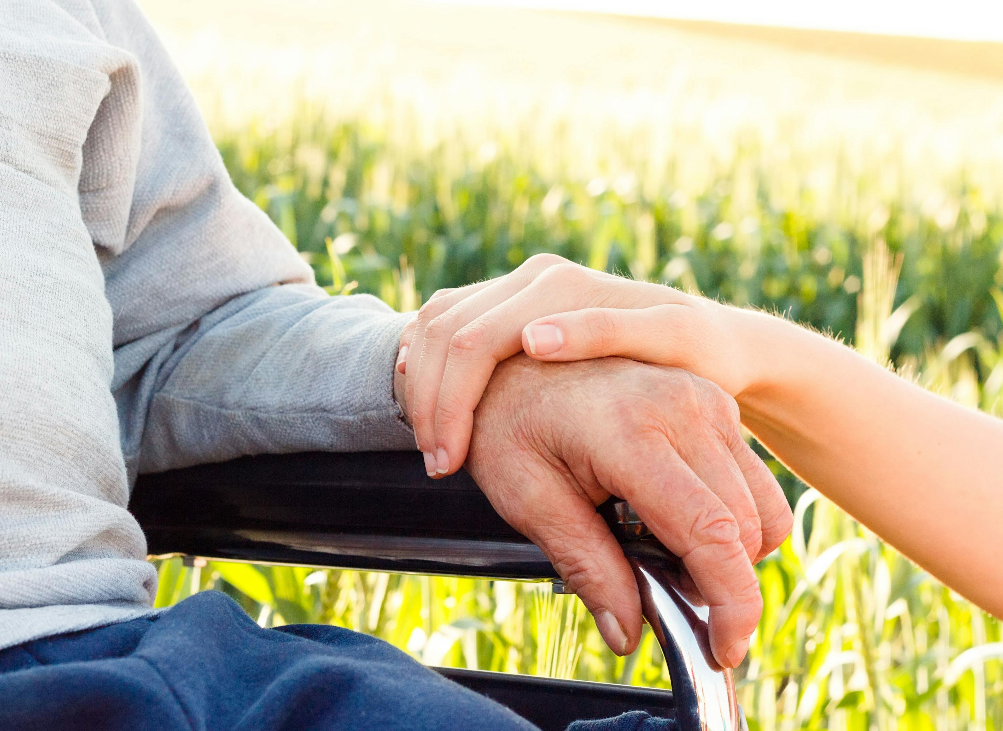 Caregiving Hold Loved One's Hand