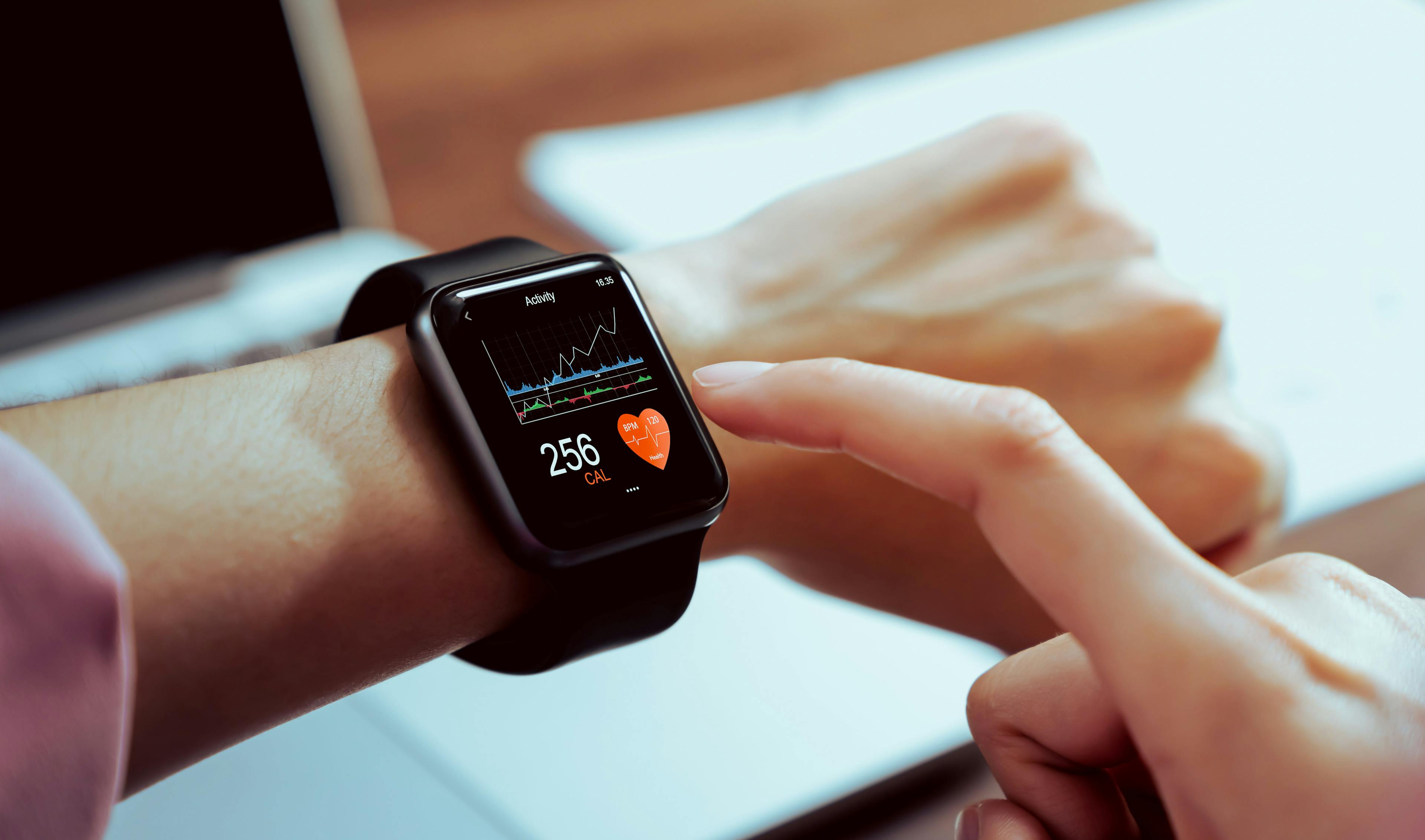 Close up of hand touching smartwatch with health app on the screen, gadget for fitness active lifestyle. © sitthiphong - stock.adobe.com