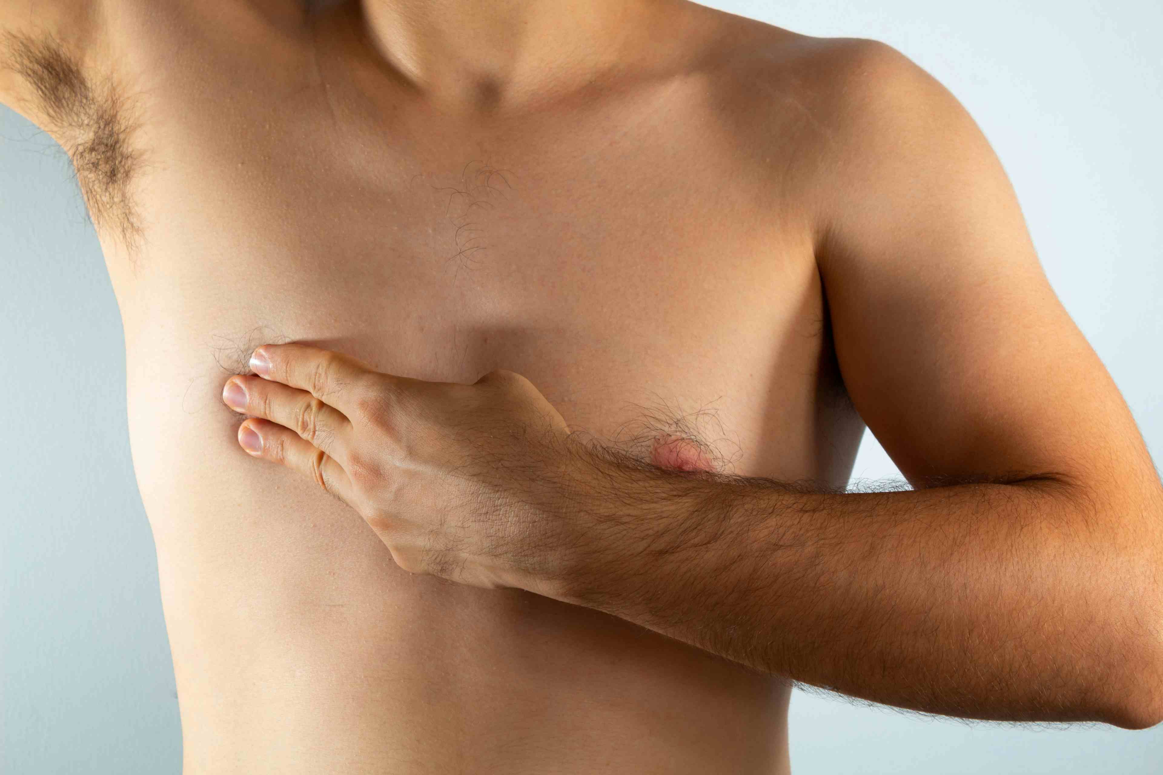 close up of a man's chest looking for signs of male breast cancer | Image Credit: © Antonio Tanaka - stock.adobe.com.