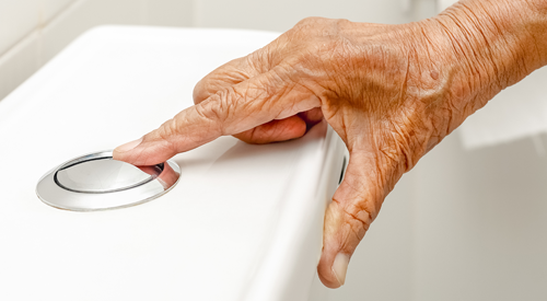 Elderly woman hand flushing toilet ©  toa555