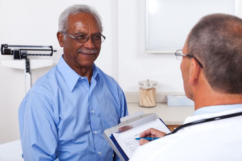 Male patient discussing treatment options with his provider
