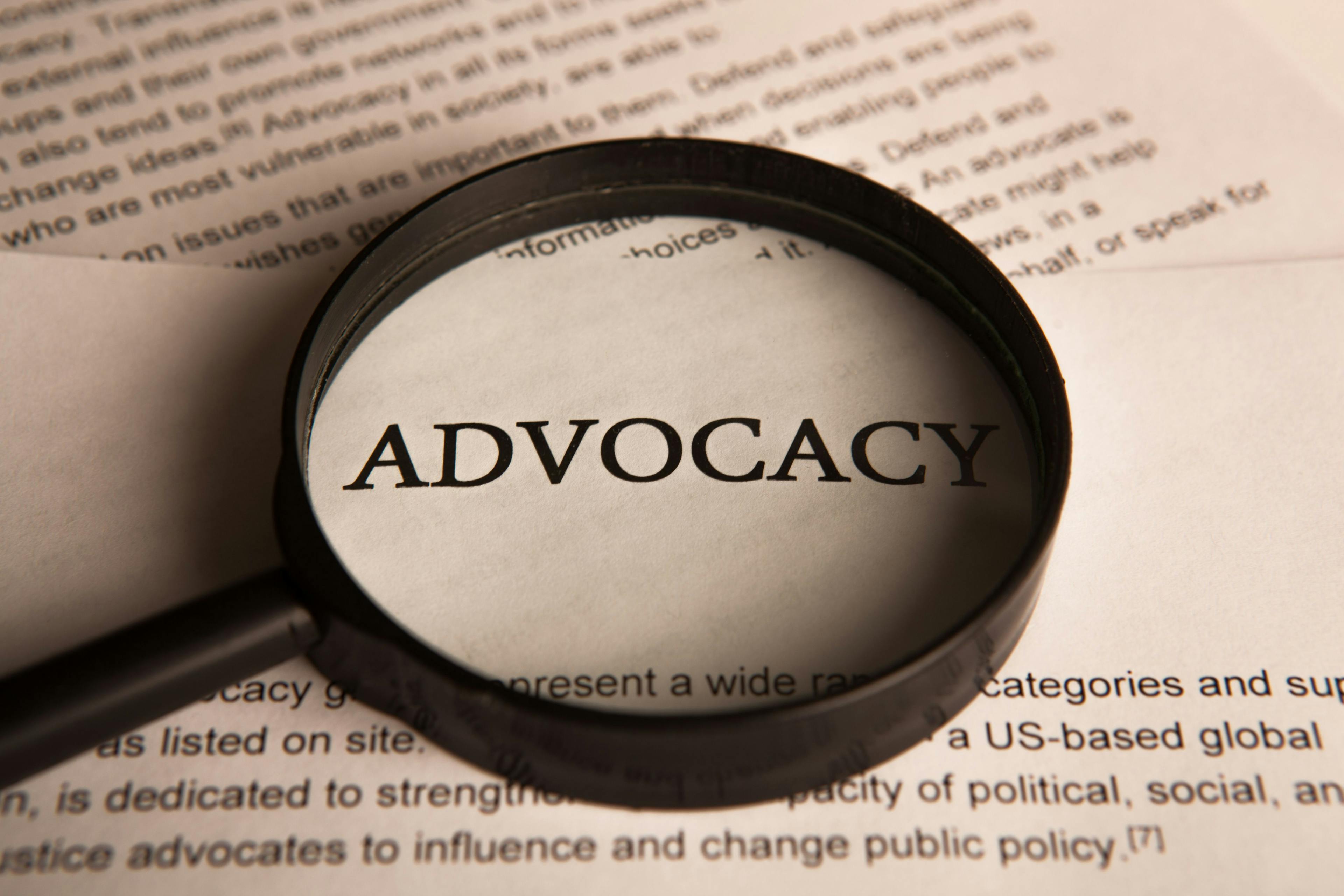 magnifying glass over the word "advocacy"