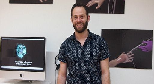 Ryan Berardi standing in front of some of his 3D animation images. - PHOTO COURTESY OF RYAN BERARDI