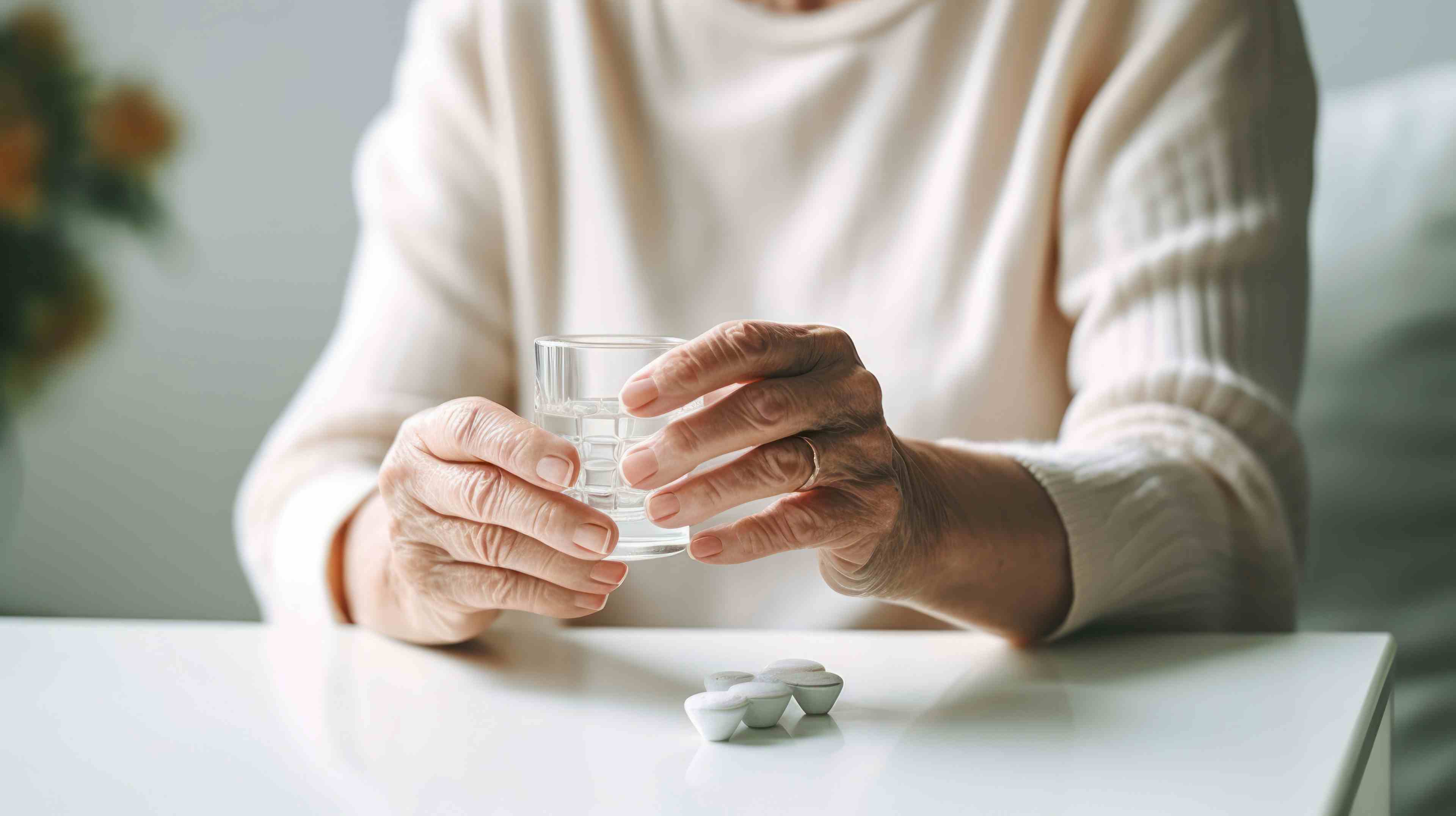 Old woman taking a pill at home, healthcare and treatment concept. | Image Credit: © sawitreelyaon - stock.adobe.com